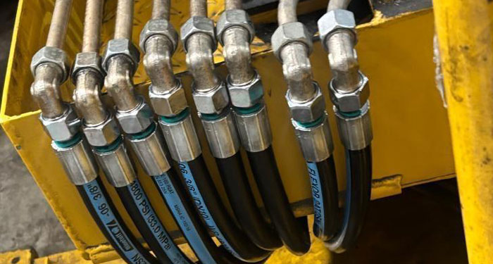 New hydraulic hose assemblies and fittings installed on industrial machinery at Heathrow