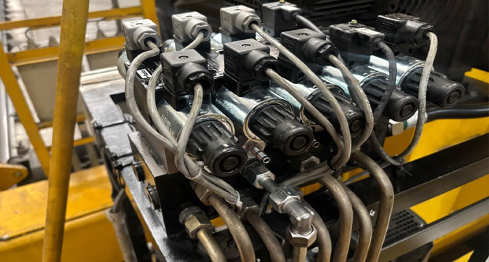 Industrial hydraulic valve assembly undergoing refurbishment at Heathrow