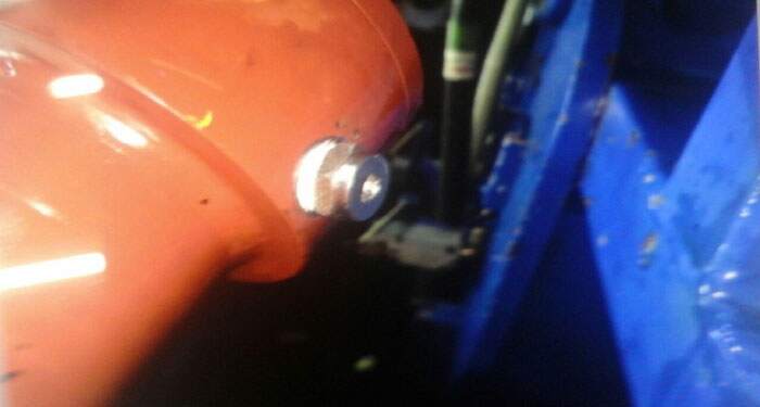 Close-up of hydraulic cylinder thread repair and adaptor modification